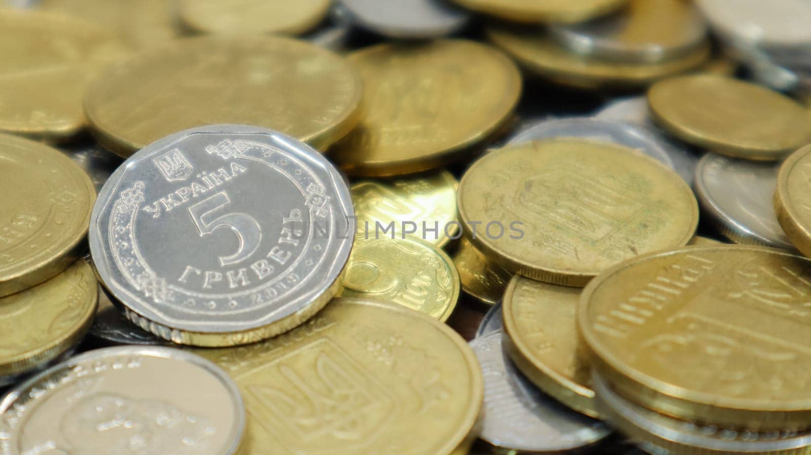 Many Ukrainian coins. National currency. Business concept. Ukrainian pennies. The concept of denomination of new and withdrawal of old coins