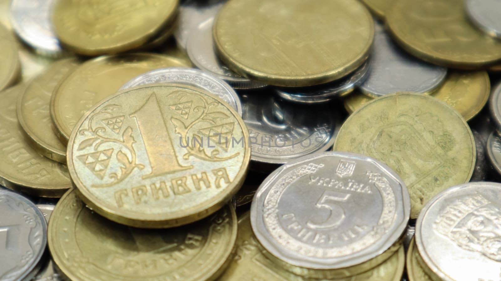 Many Ukrainian coins. National currency. Business concept. Ukrainian pennies. The concept of denomination of new and withdrawal of old coins