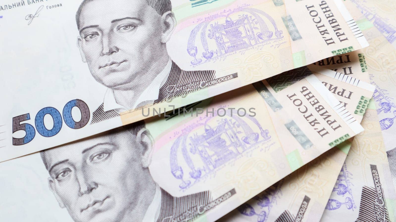 Ukrainian hryvnia, a lot of new banknotes in denominations of 500 hryvnias beautifully laid out on the table. Financial background, money