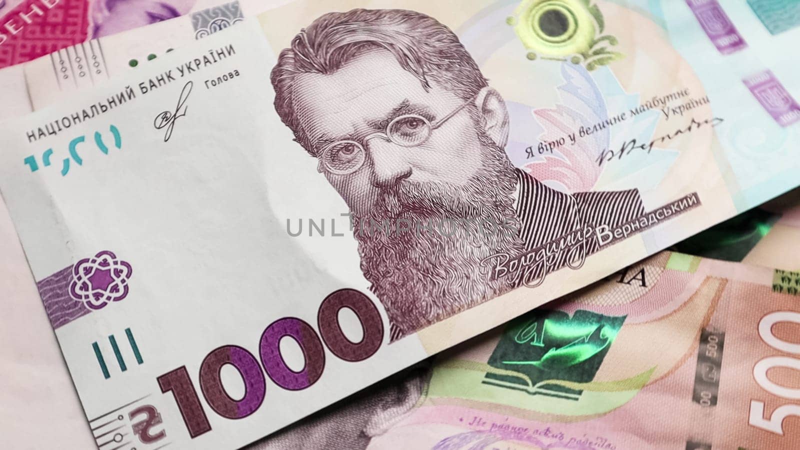 One paper bill of 1000 hryvnia. Portrait of Vladimir Ivanovich Vernadsky on the Ukrainian banknote. Ukrainian money. Money background.