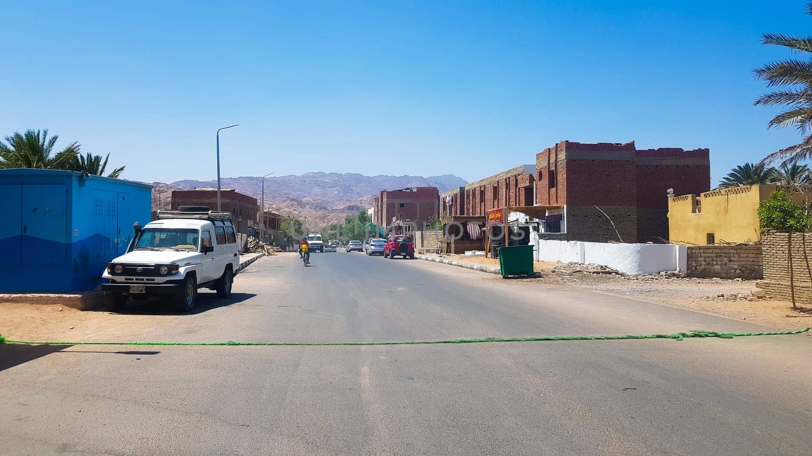 Egypt, Dahab - June 20, 2019: desert street. Egyptian residential buildings. The city of Dahab. surroundings of the spa town on a sunny day