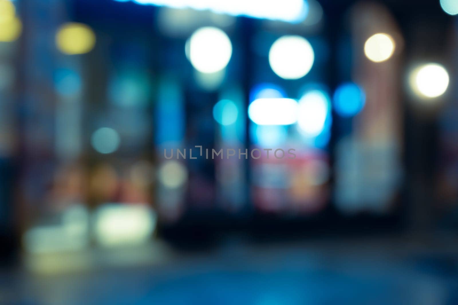 Abstract blur and defocused coffee shop and restaurant with coloful bokeh night lights for background