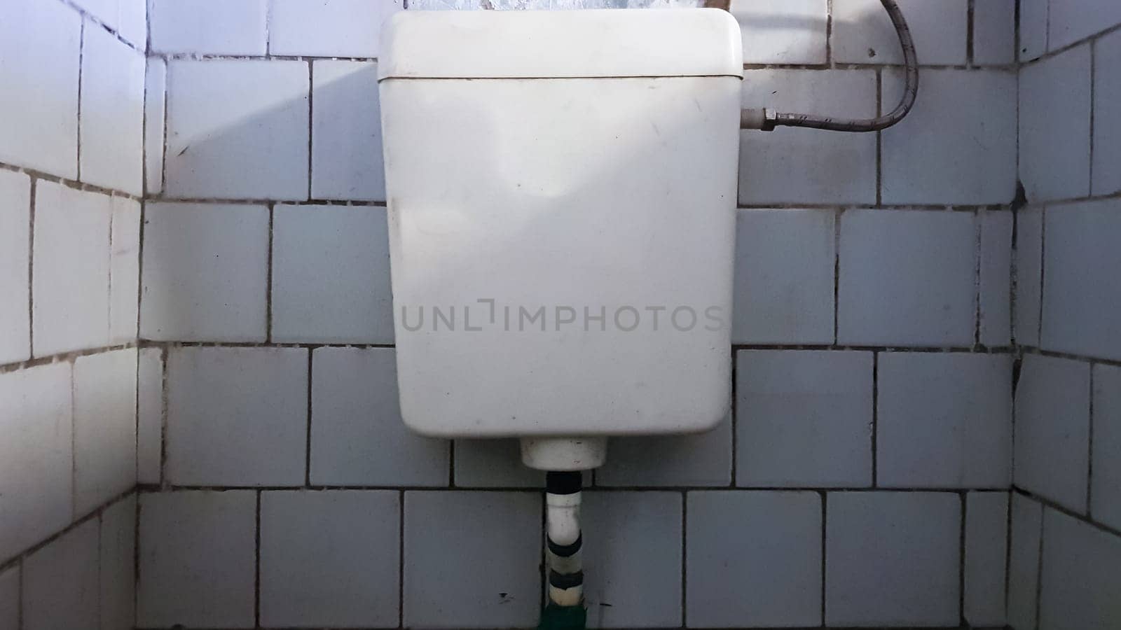 dirty old and dusty toilet in a public abandoned building. Ruined hygiene room