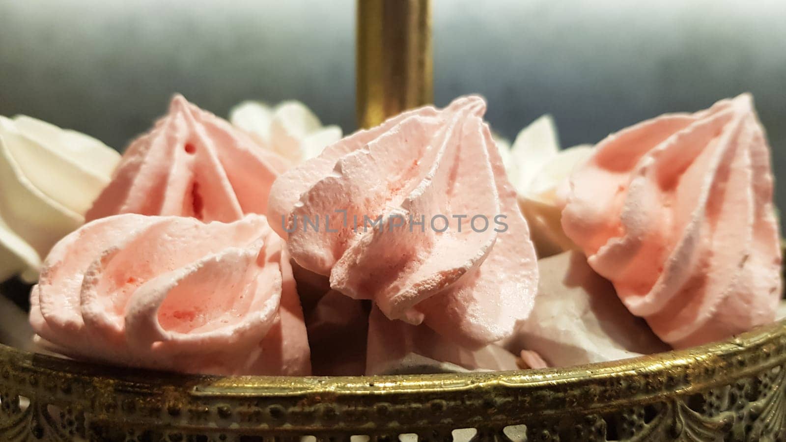 Color sweet homemade meringues and marshmallows. Airy and tender pastry marshmallows dessert. The sweet dish you want to eat. Sweets in the dark