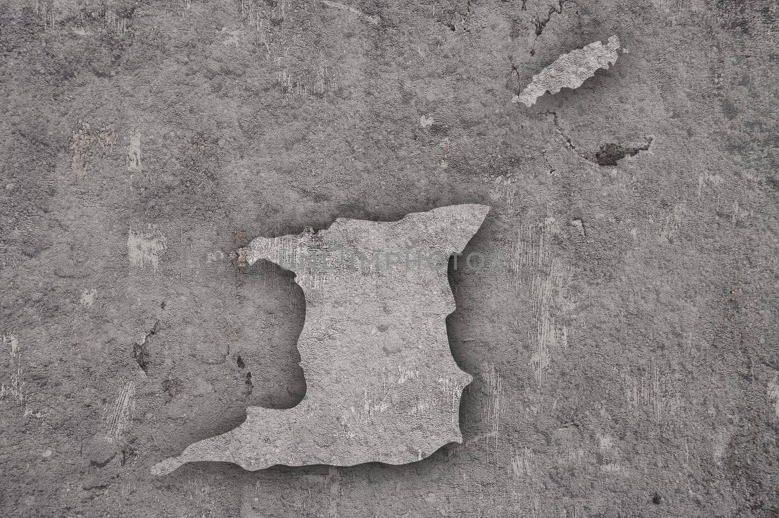 Map of Trinidad and Tobago on weathered concrete