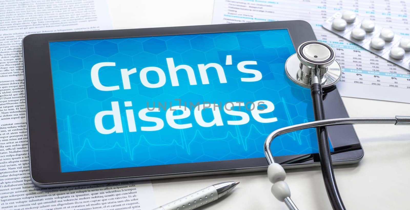 The word Crohn's disease on the display of a tablet