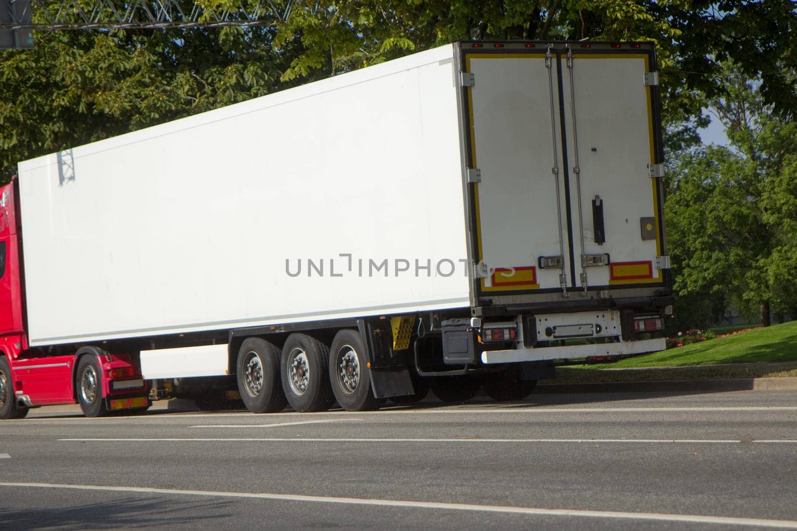 truck is driving on the streets of the city