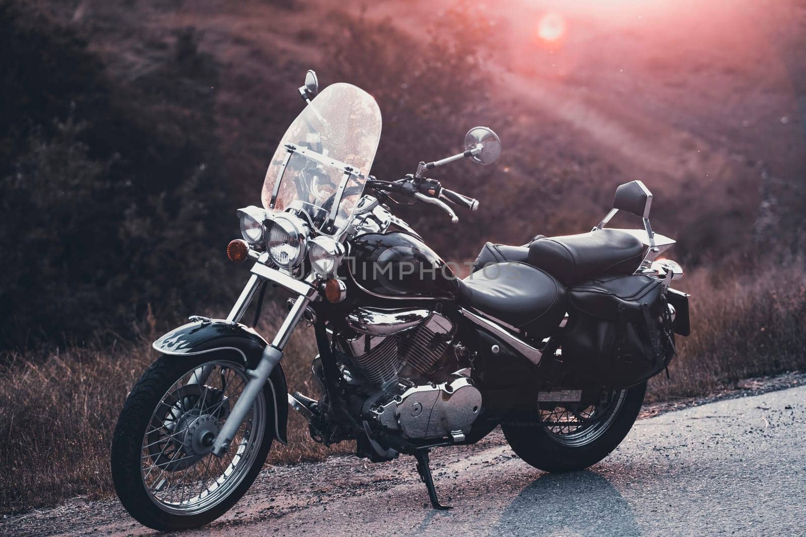 Vintage motorcycle on country road.
