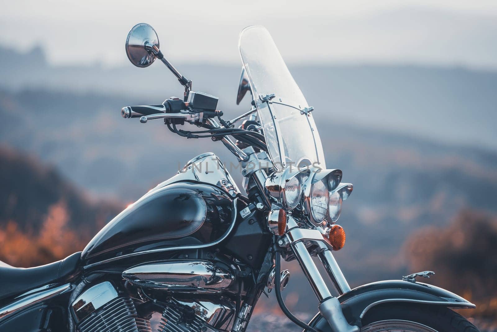 Motorcycle detail closeup front fork and headlight. Travel and sport, speed and freedom concept