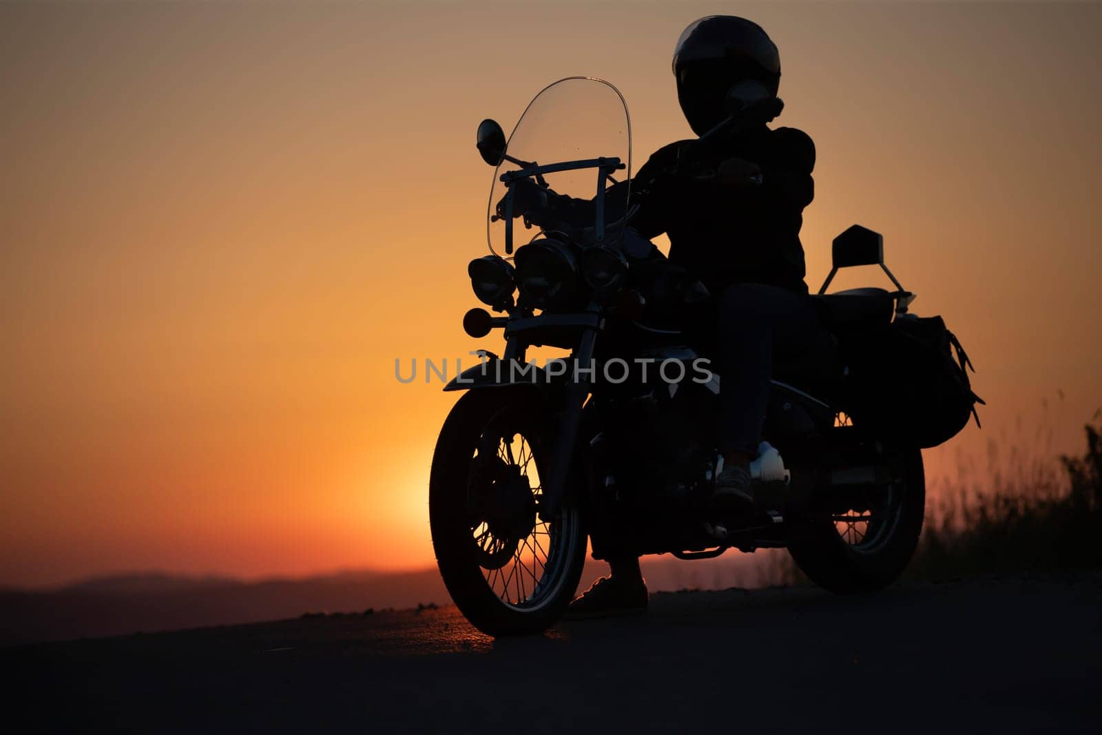 Motorcycle driver riding on countryside. Travel and sport, speed and freedom concept