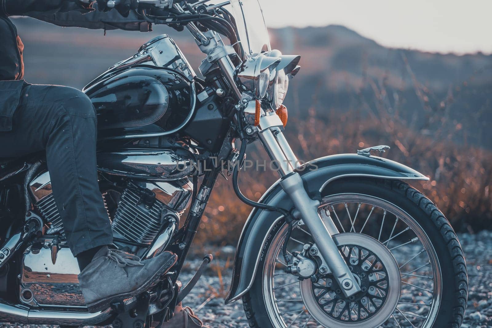 Motorcycle detail closeup front fork and headlight. Travel and sport, speed and freedom concept