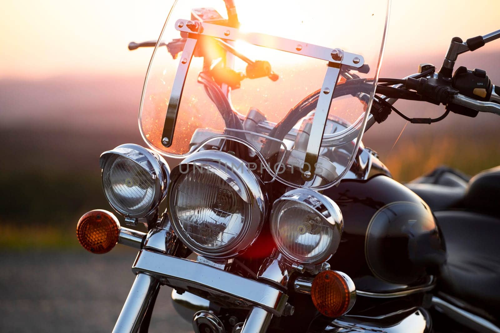 Motorcycle detail closeup front fork and headlight. Travel and sport, speed and freedom concept