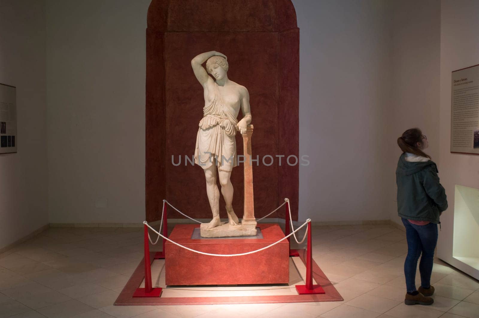 Ecija, Spain - April 21th, 2019: Visitor young woman at Ecija Municipal Museum of History, Seville, Spain
