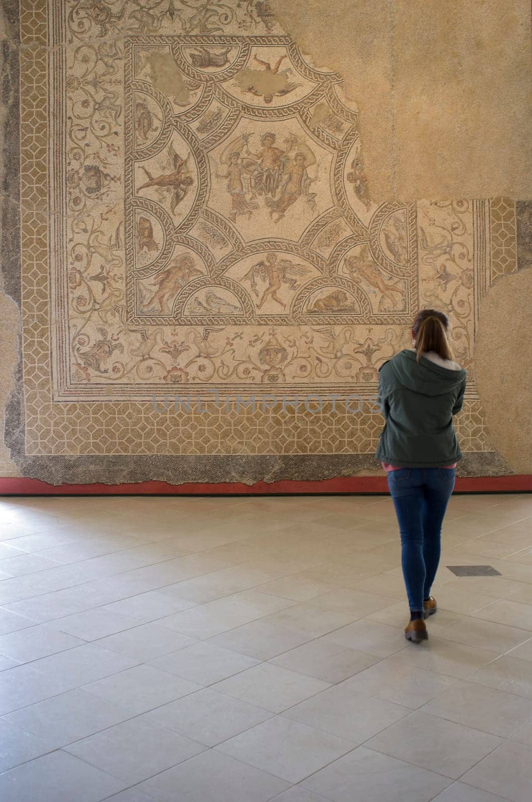 Ecija, Spain - April 21th, 2019: Visitor young woman at Ecija Municipal Museum of History, Seville, Spain