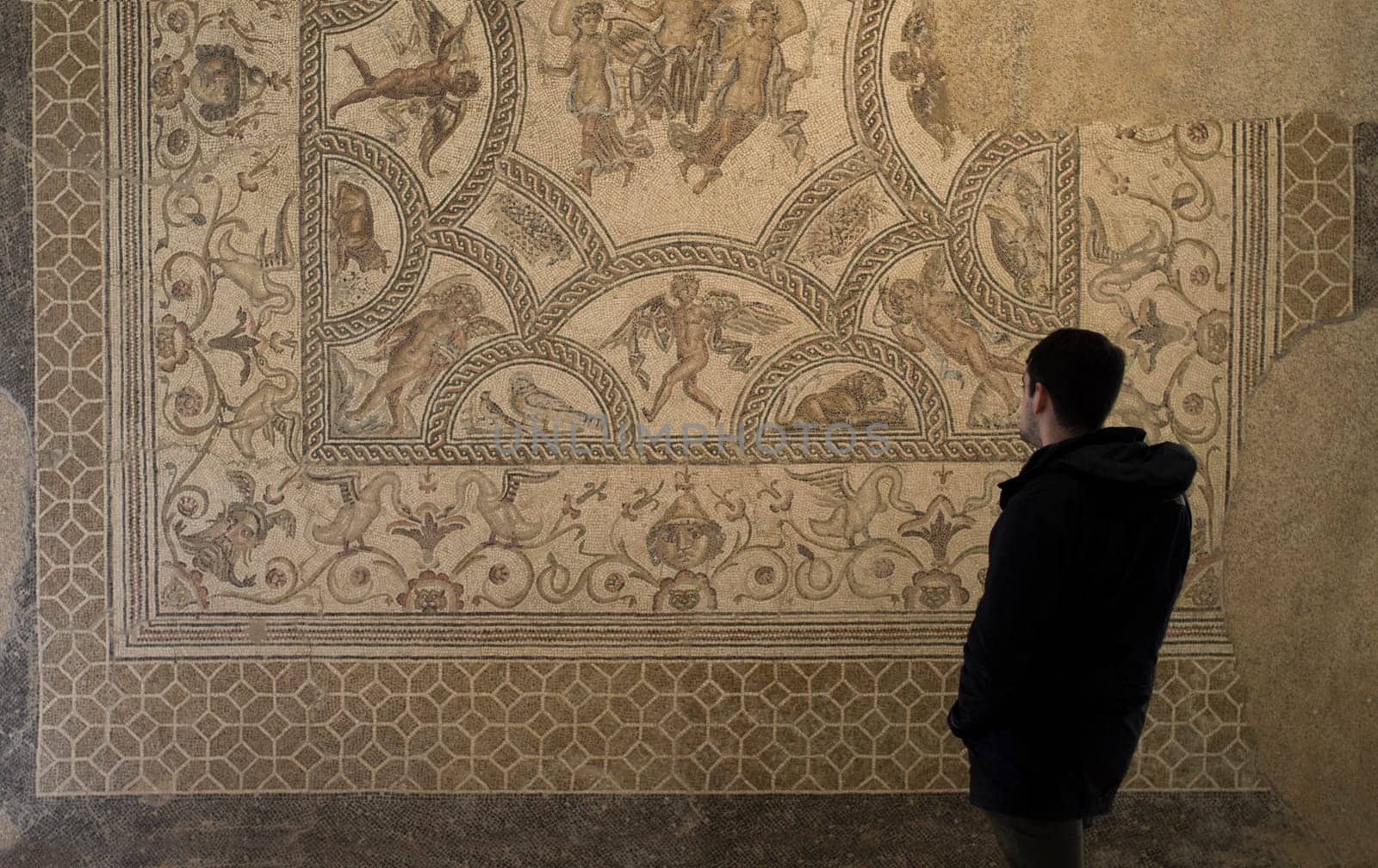 Ecija, Spain - April 21th, 2019: Visitor young man at Ecija Municipal Museum of History, Seville, Spain