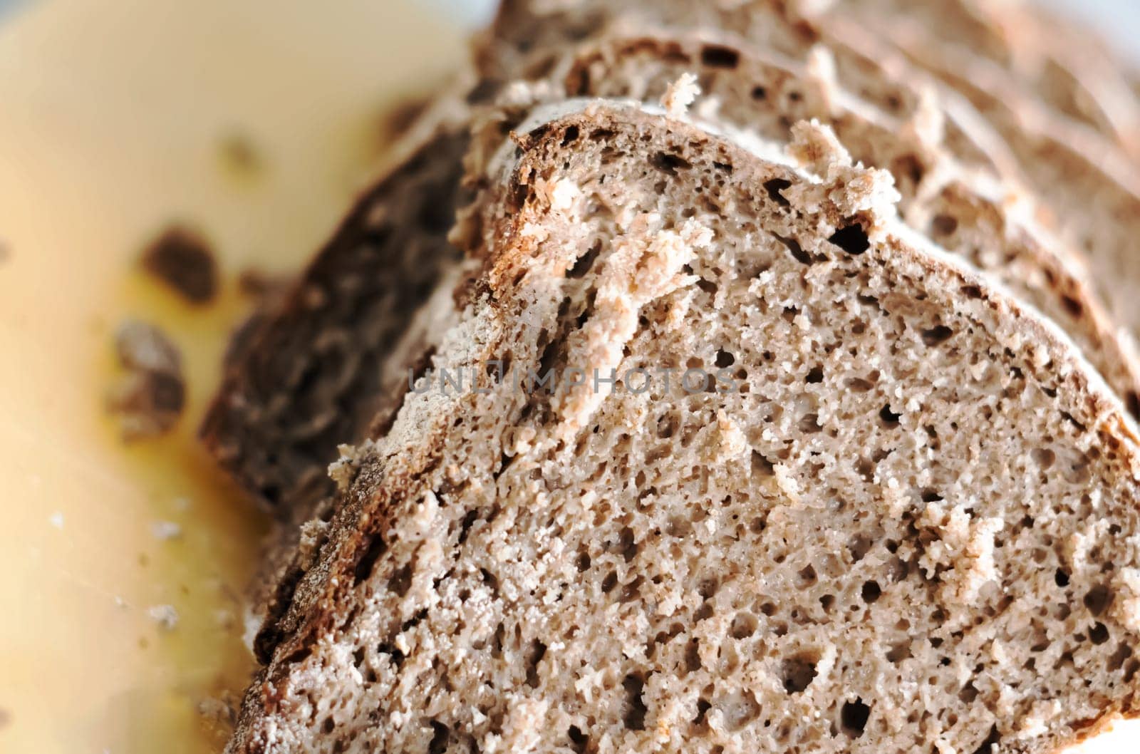 Close-up view of some slices of fresh rye bread. Healthy food and source of fiber. Bakery product