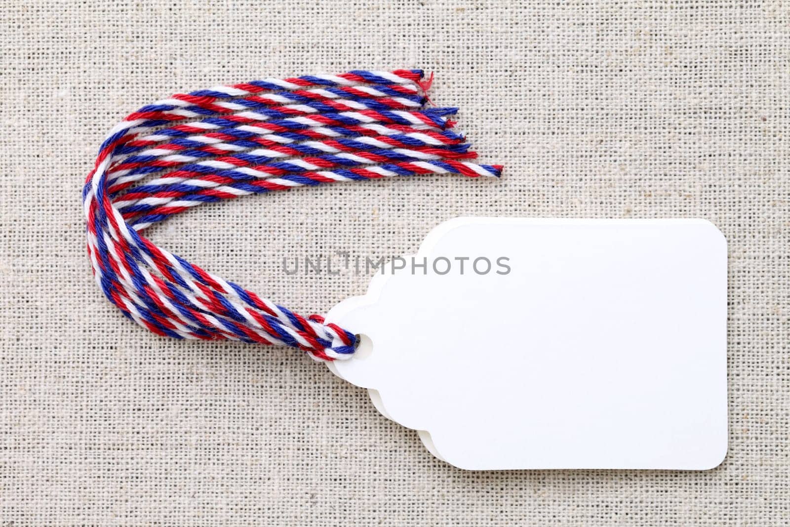 blank tag or label on burlap background