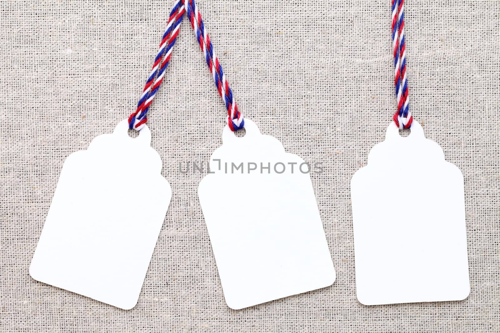 blank tag or label on burlap background