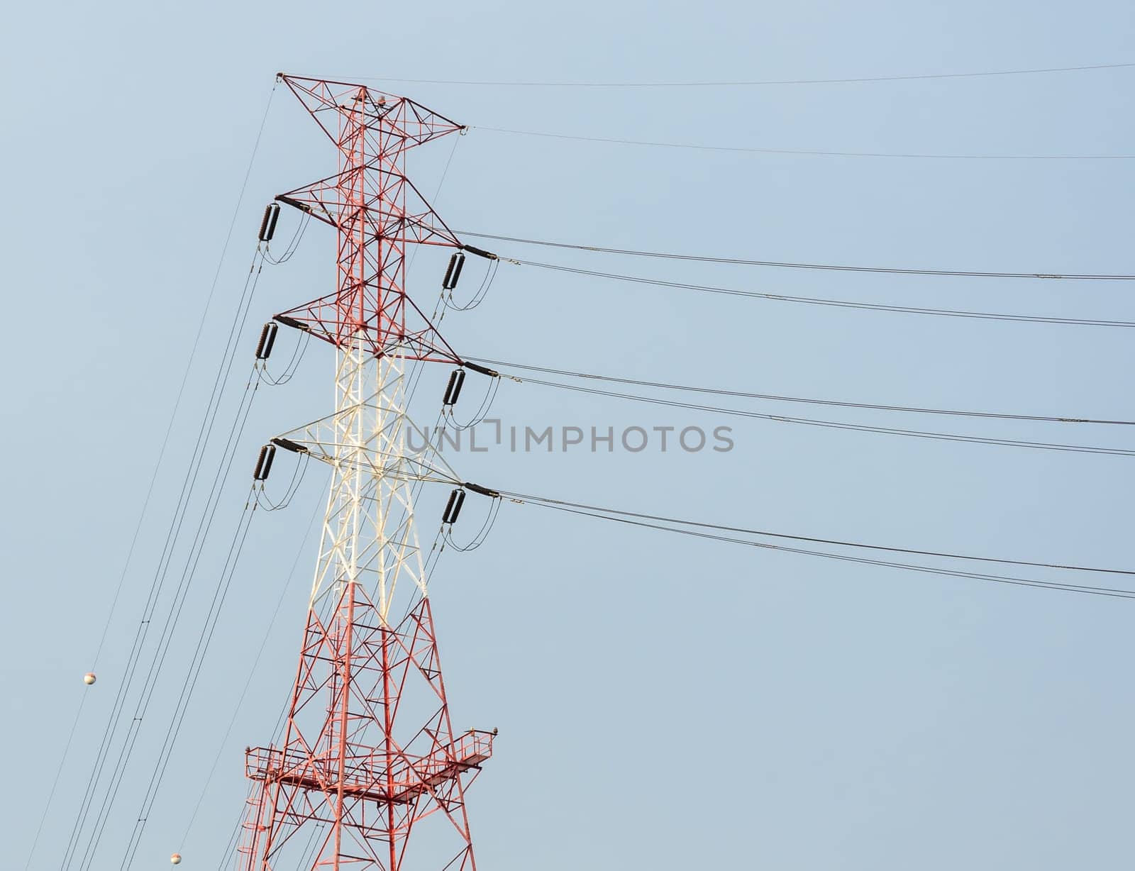 Electricity pylon or transmission tower in blue sky