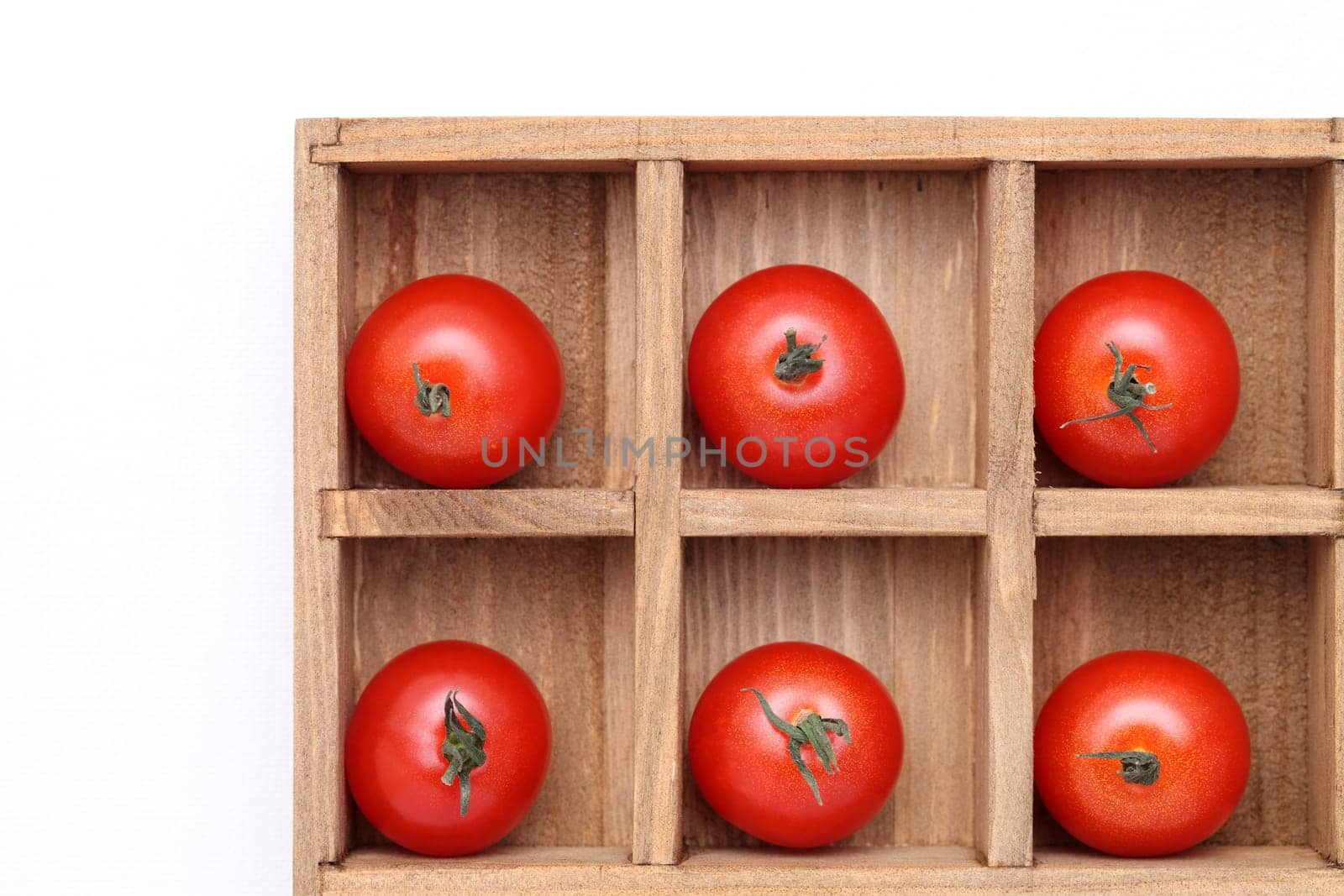 cherry tomatoes in wooden box