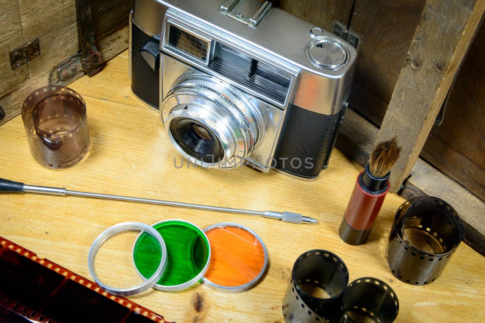old camera with some accessories and films