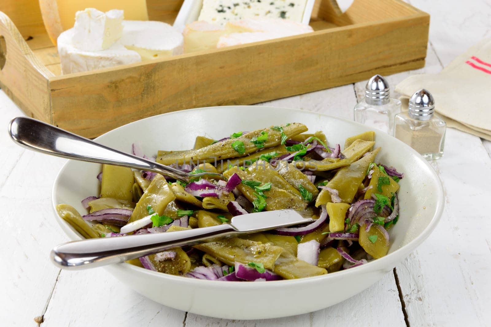 plate of fresh green beans with cheeses