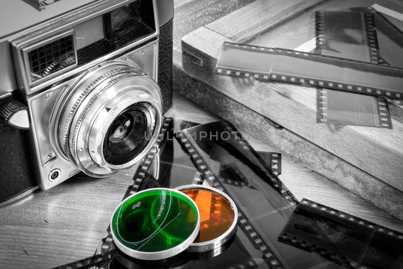 old camera with some accessories and films