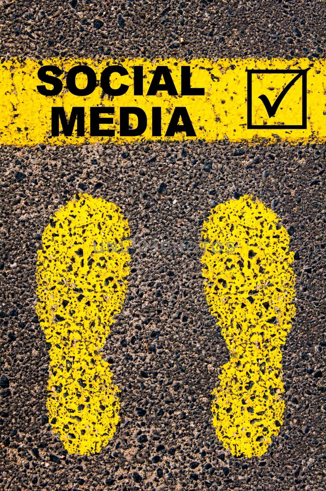 Conceptual image with yellow paint footsteps on the road in front of horizontal line over asphalt stone background. Word XXXXXXXX