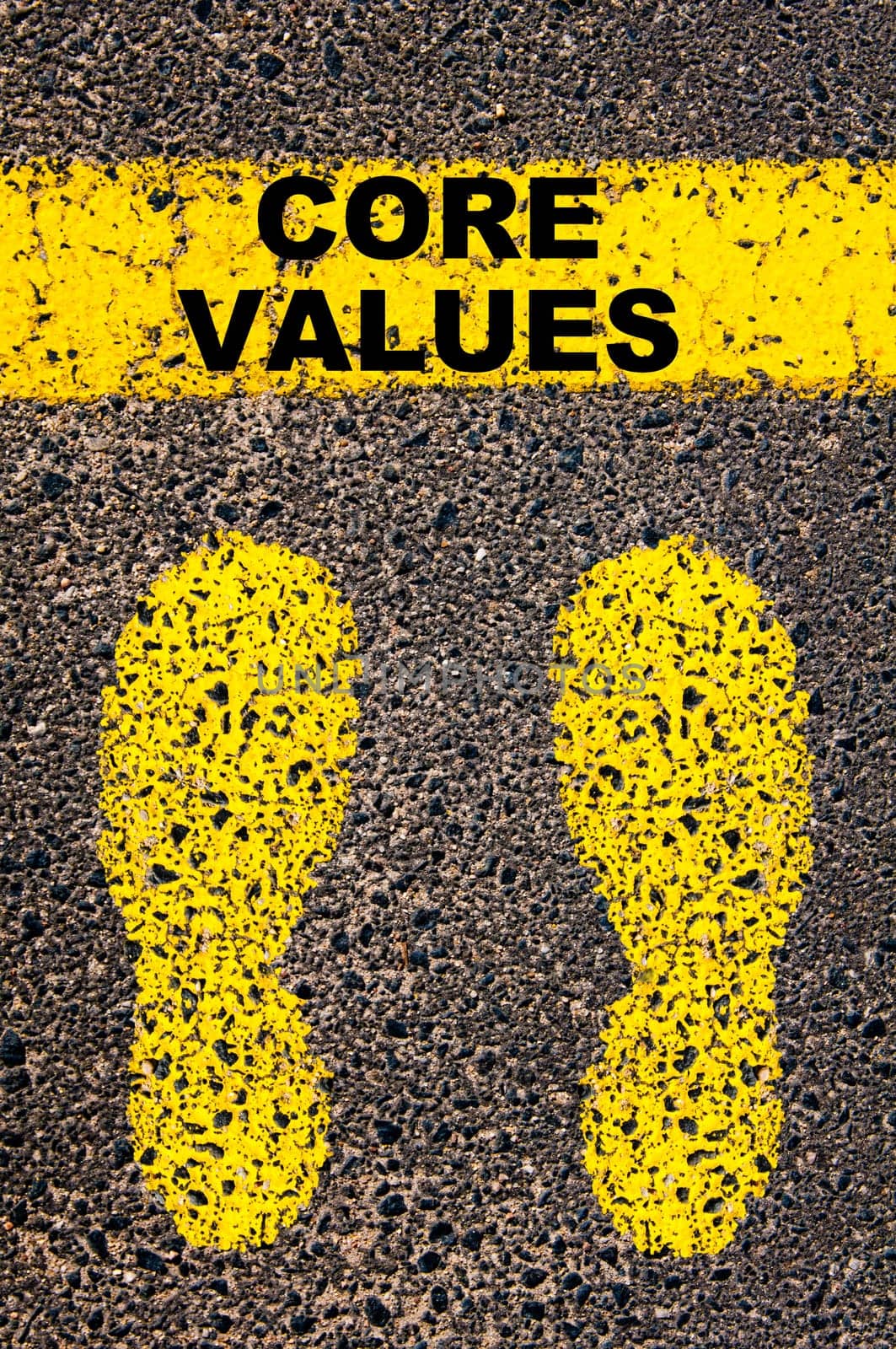 Conceptual image with yellow paint footsteps on the road in front of horizontal line over asphalt stone background. Word XXXXXXXX