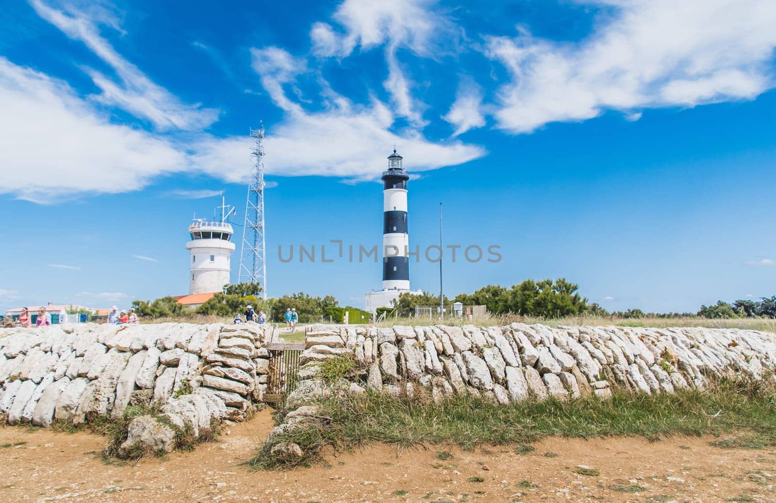 Chassiron lighthouse and semaphore on the Ile d'Oléron in France on blue sky, on the island of Oléron in France