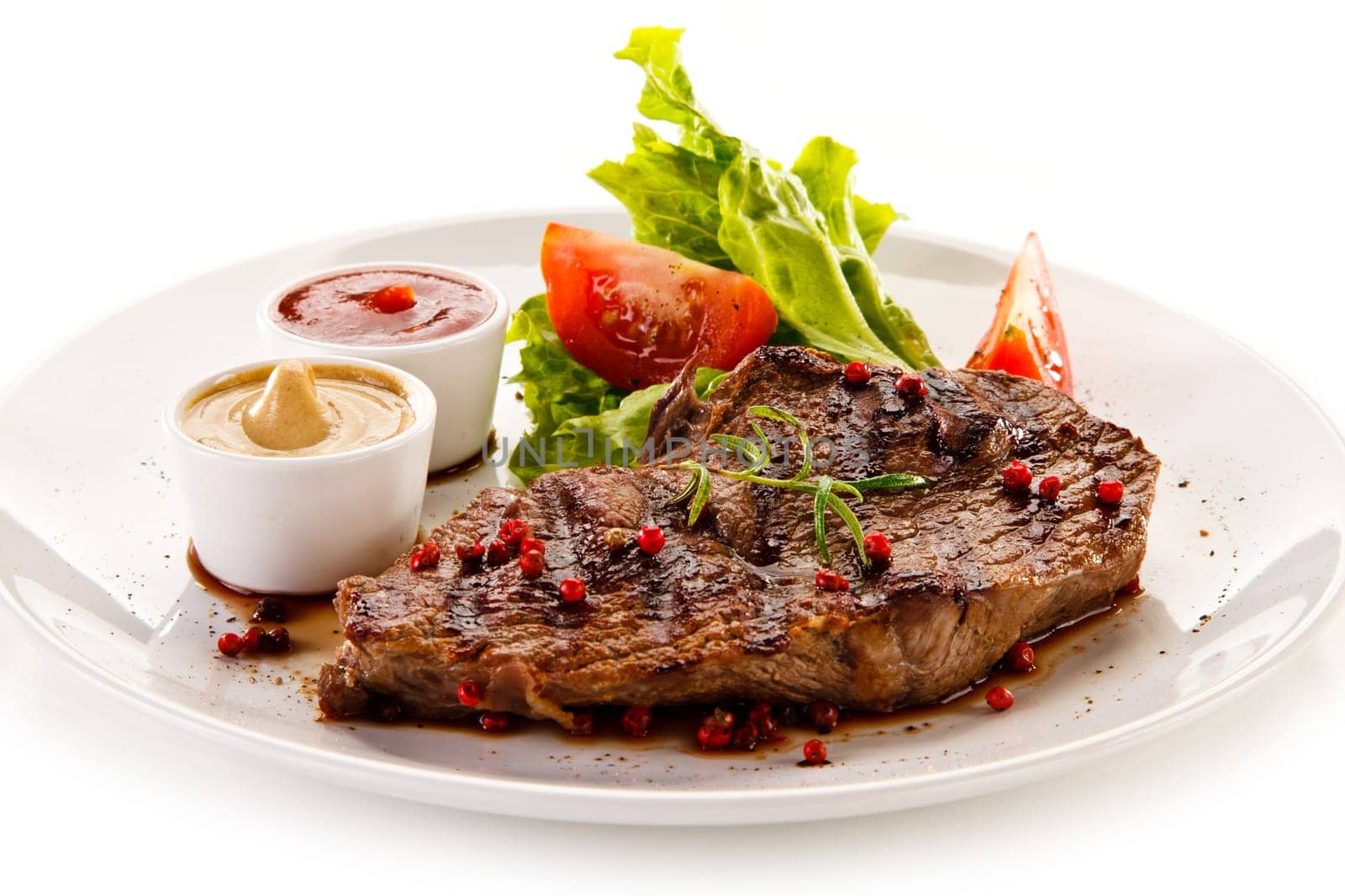 Grilled steaks and vegetables