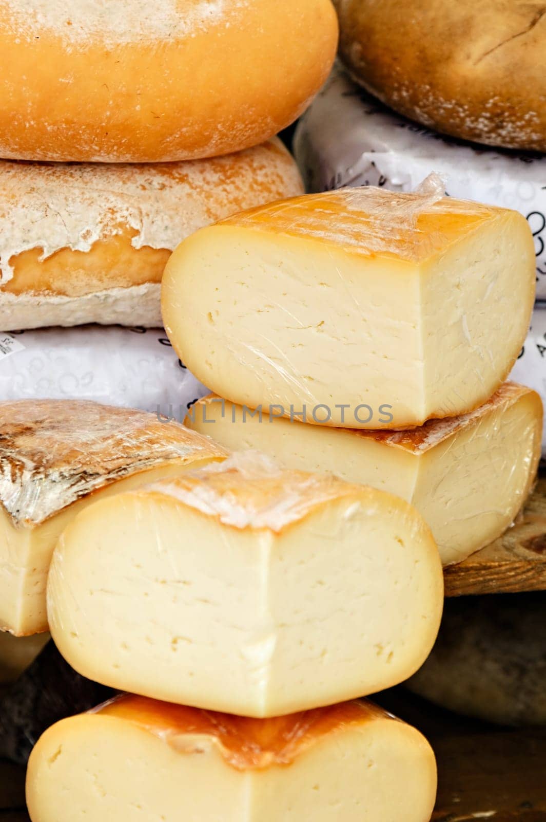 Cheese on a traditional craftsman market.Vertical image.