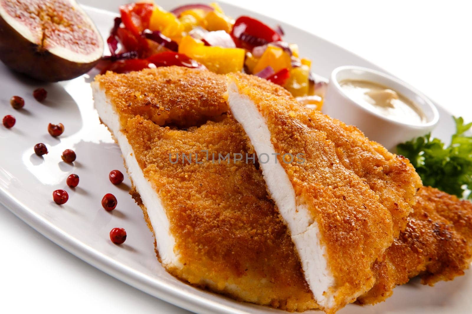Fried pork chop coat in breadcrumbs and vegetable salad