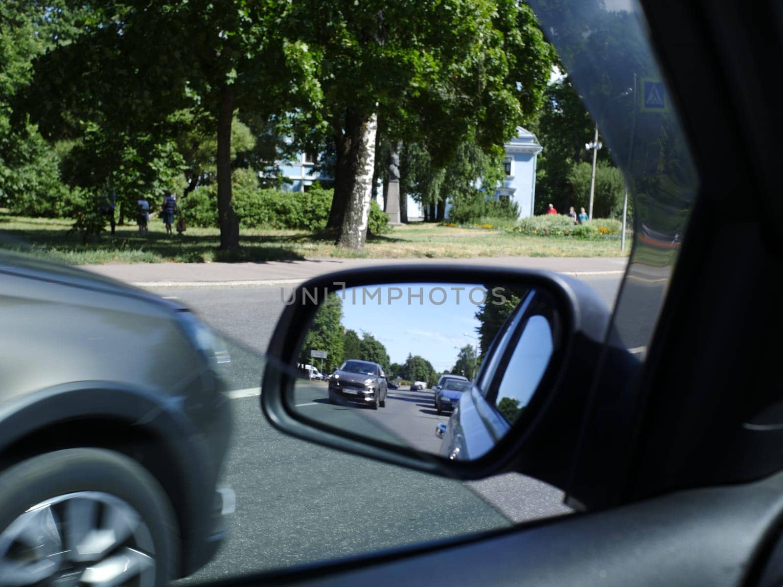 road in the car rearview mirror first person view