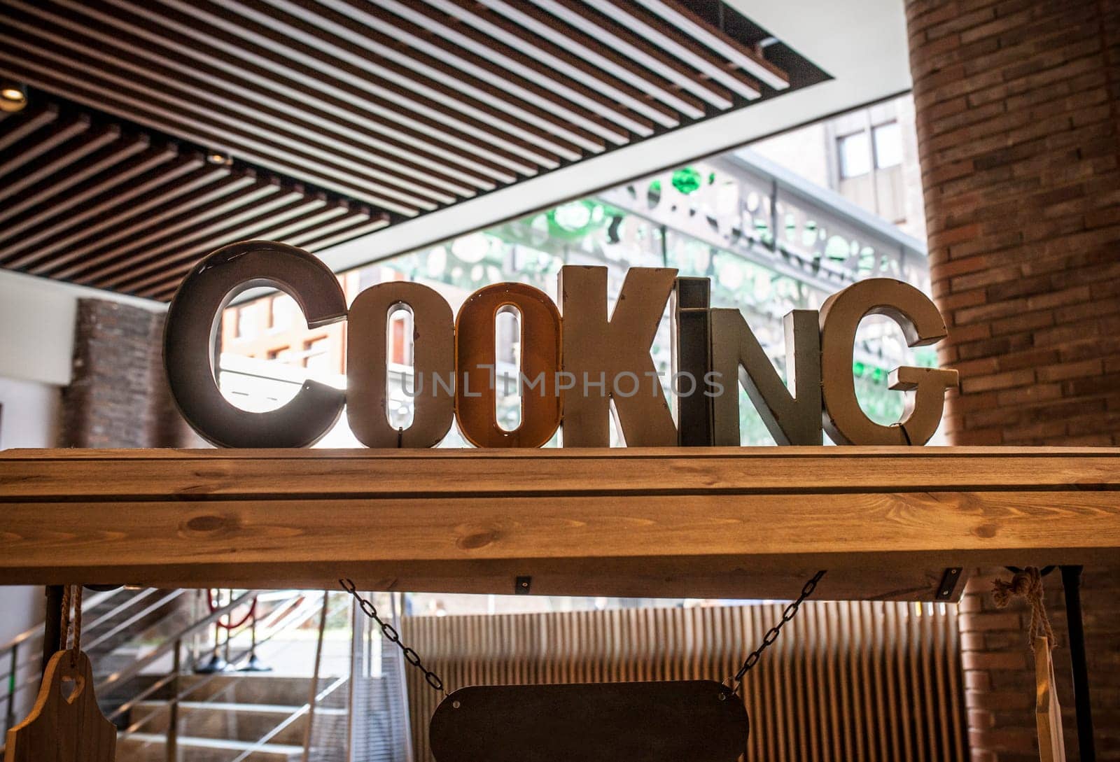 Wooden cooking letters over appetizers cart. Catering decoration concept