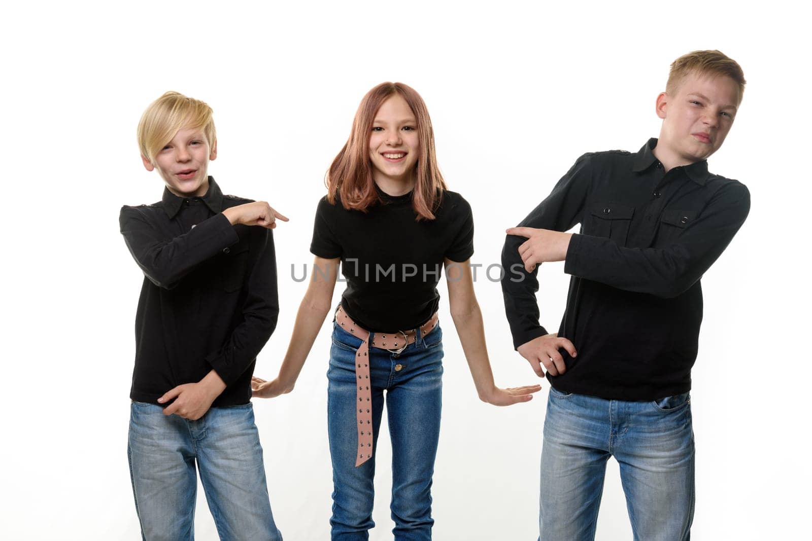 Happy girl surrounded by boring brothers