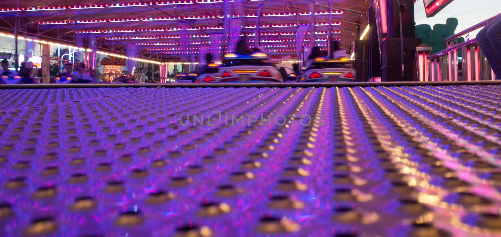 Fairground bumper cars plenty. Ground level shot