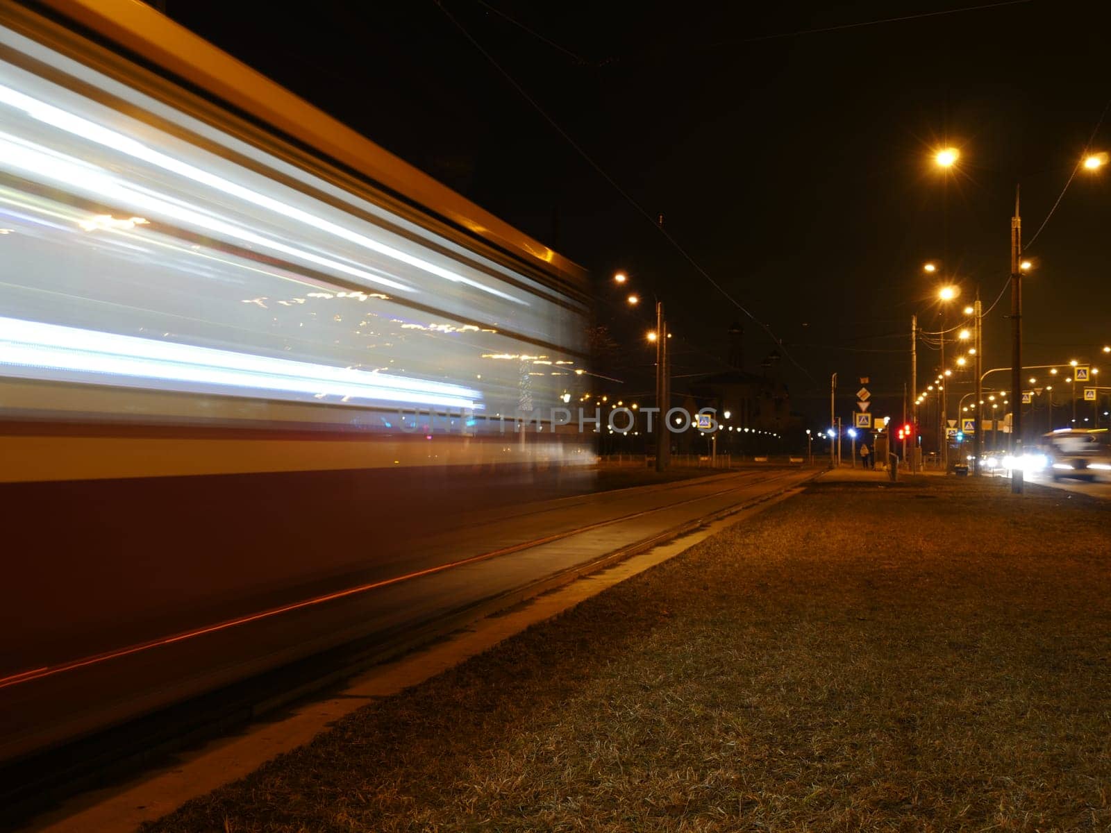 tram blurry motion  passing by at night, long exposure