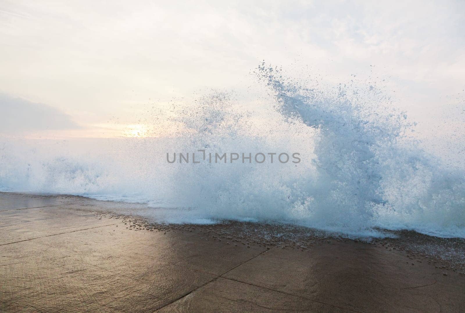 Splashing wave on dyke during high tide in Saint Malo, Brittany, France