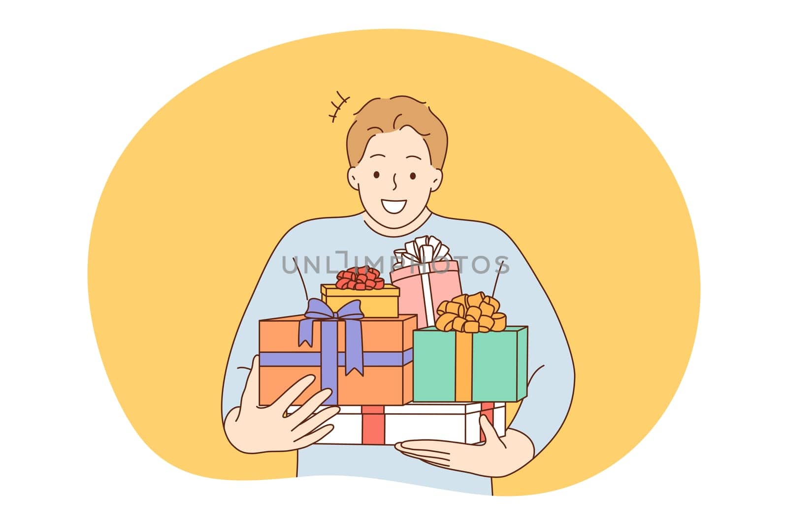 Anniversary, Birthday or Christmas present, celebration concept. Young happy man man carrying heap of birthday gifts in boxes with festive ribbons. Surprise, anniversary, gift, happiness
