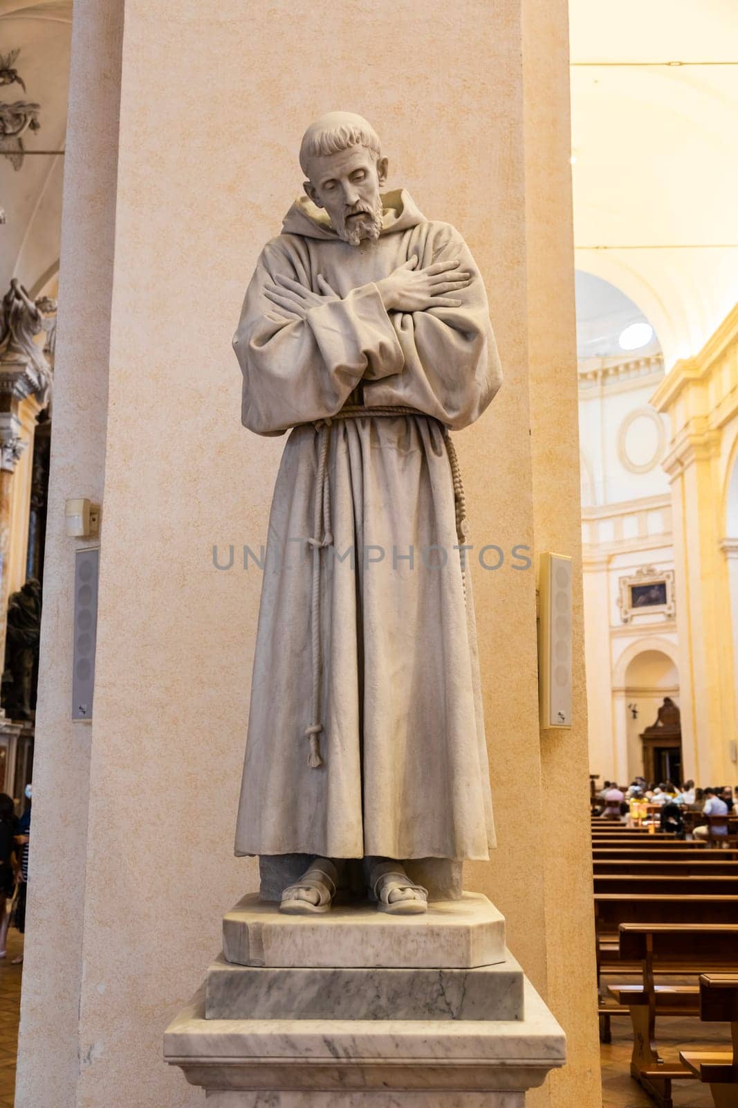 Assisi village in Umbria region, Italy. Statue of St. Francis. The town is famous for the most important Italian St. Francis Basilica (Basilica di San Francesco)