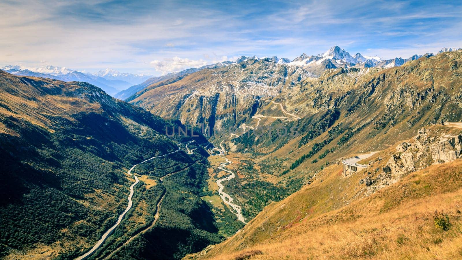 Scenic view of a switchback road through the mountains in Switzerland
