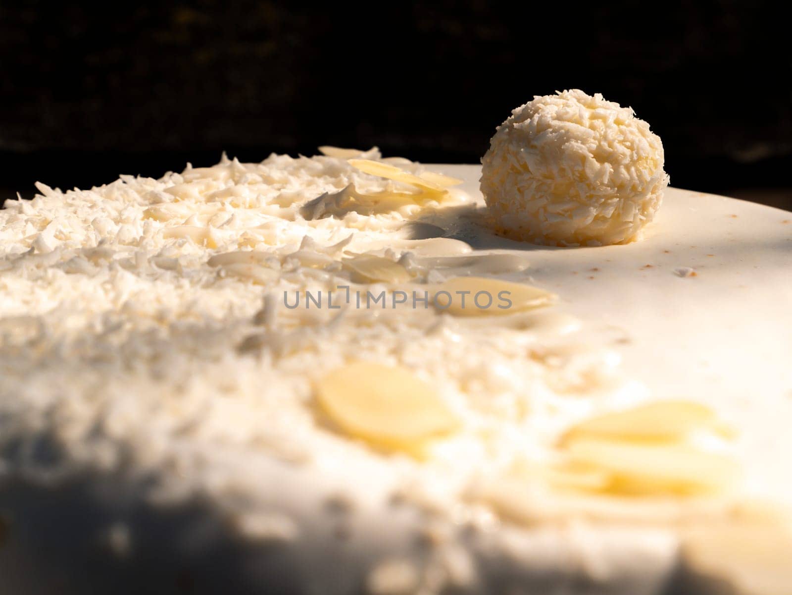 Celebratory cake with white cream and nuts. Birthday. Bakery products. Cooking Shop window. Place for text. Background image. Sweets.