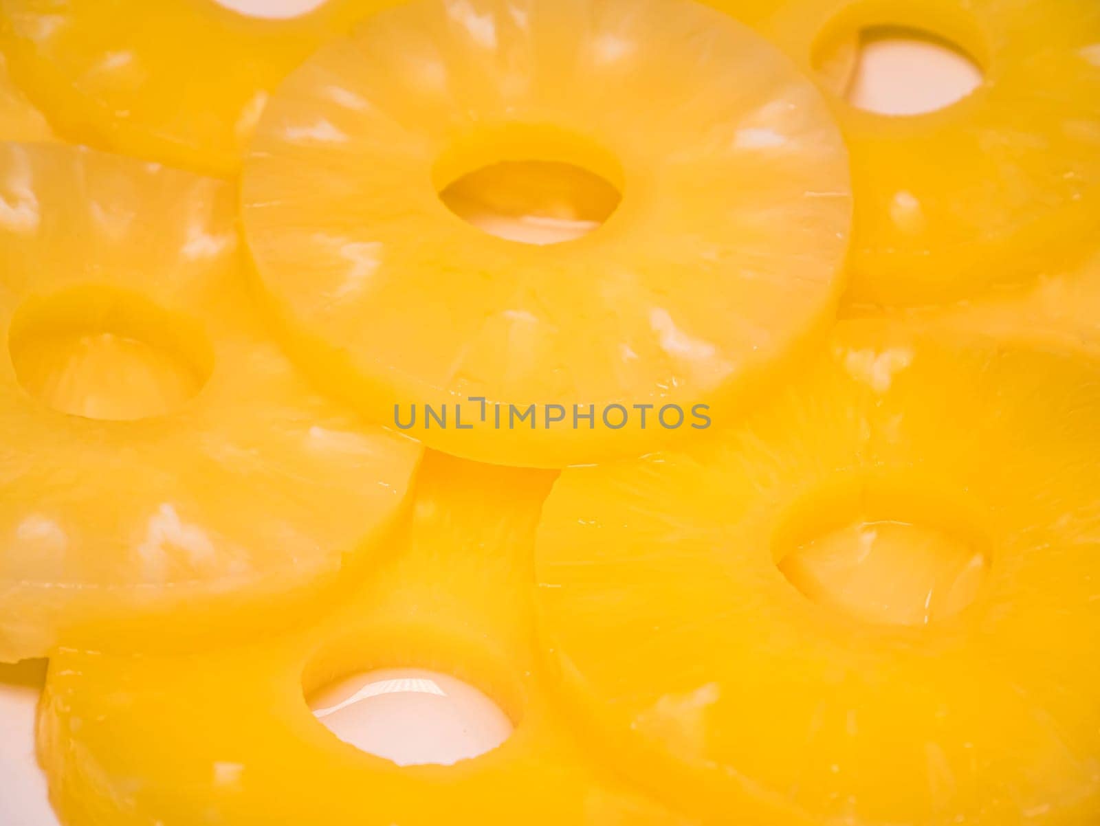 Sliced pineapple on a plate. Food photo. Place for text.