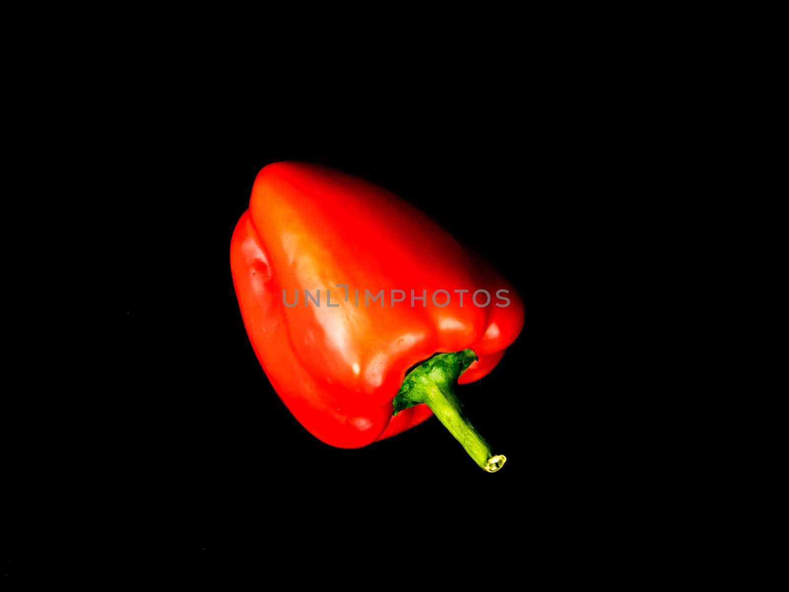Vegetable red bell pepper on a black background. Food photo. Template for text. The menu of dishes. Place for text. Background image.