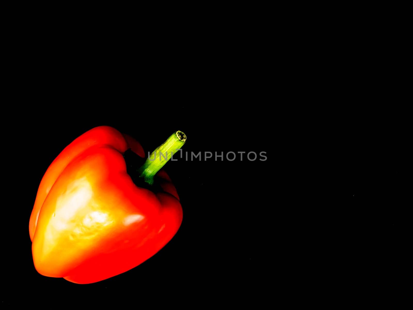 Vegetable red bell pepper on a black background. Food photo. Template for text. The menu of dishes. Place for text. Background image.