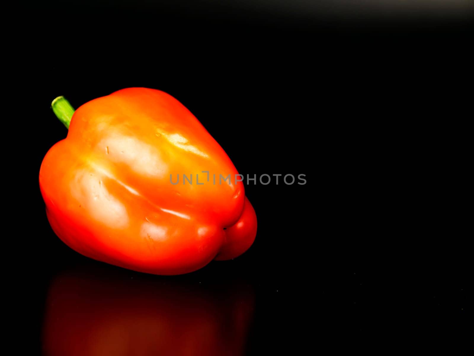 Vegetable red bell pepper on a black background. Food photo. Template for text. The menu of dishes. Place for text. Background image.