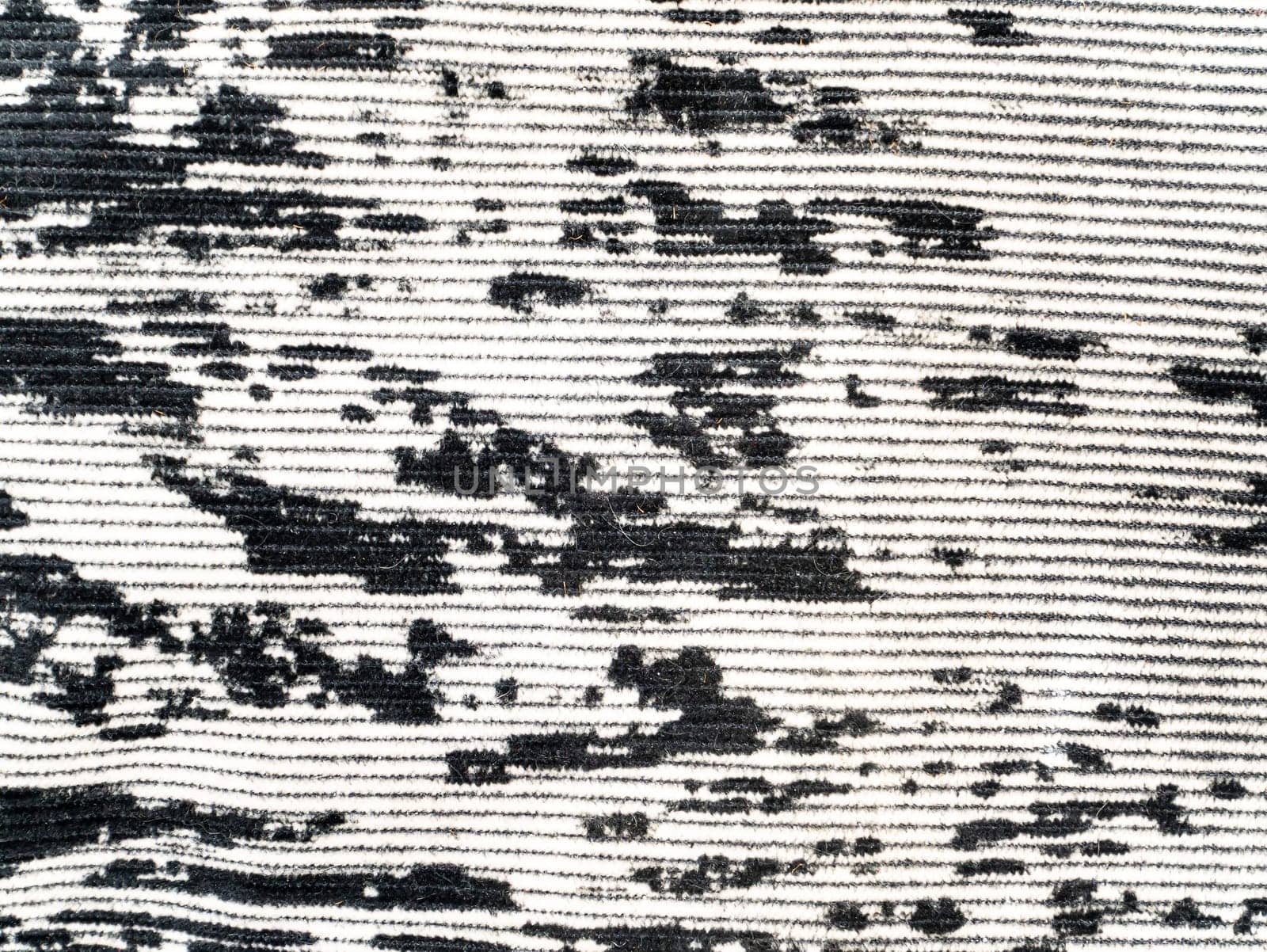 The texture of black and white velvet fabric. Background image. Place for text.