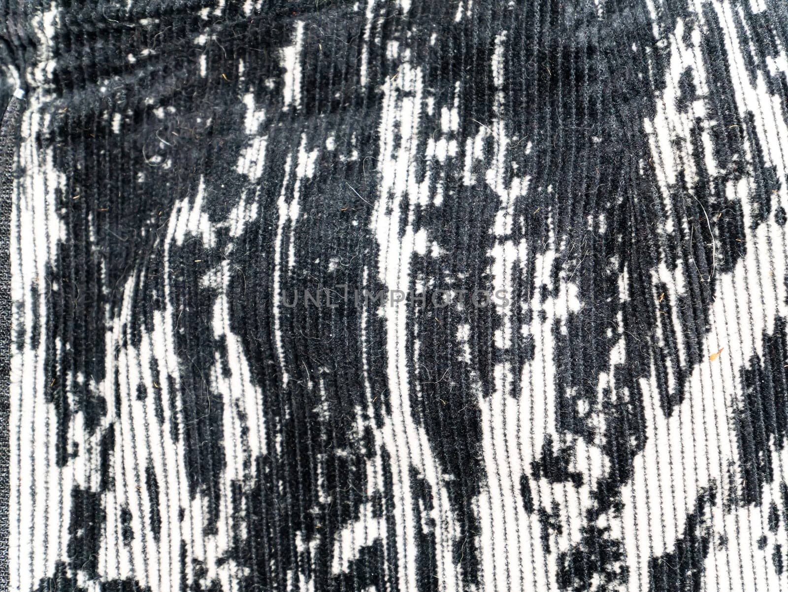 The texture of black and white velvet fabric. Background image. Place for text.