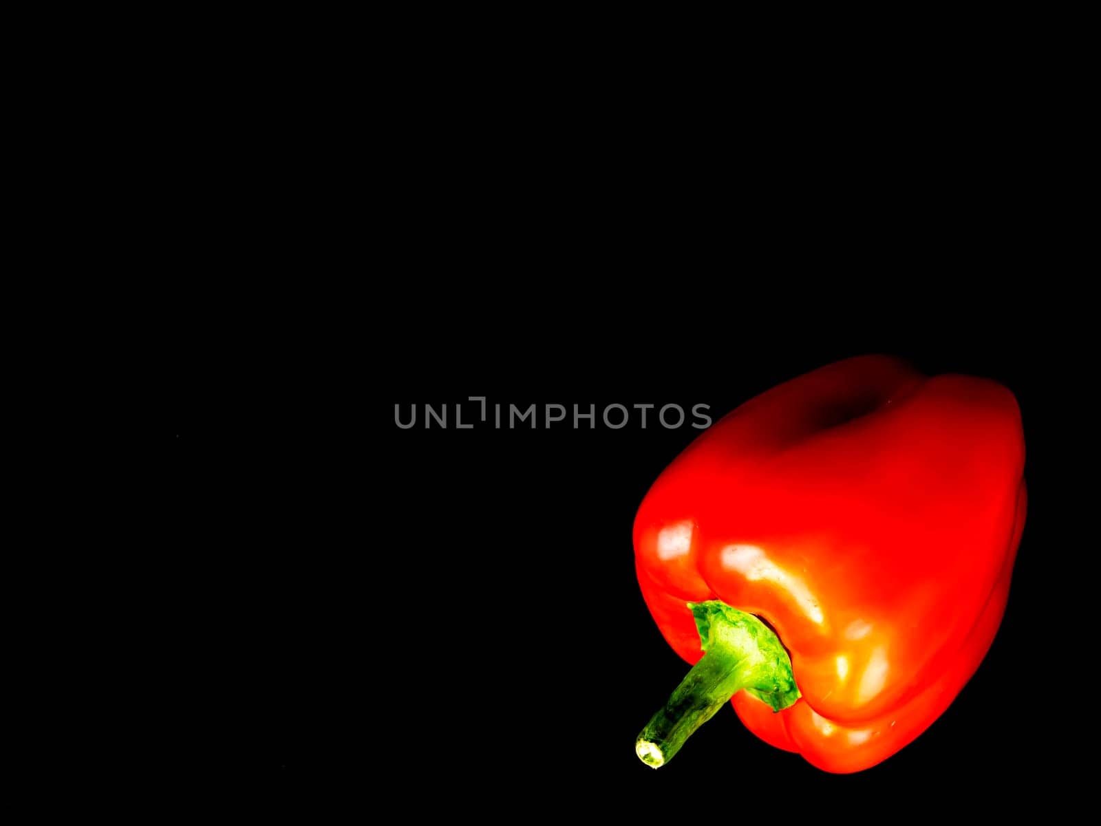 Vegetable red bell pepper on a black background. Food photo. Template for text. The menu of dishes. Place for text. Background image.